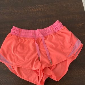 Lululemon Neon Pink Grapefruit 2.5 inseam Hotty Hot shorts
